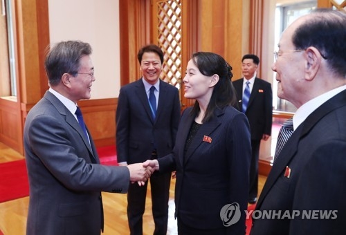 The photo, taken Feb. 10, 2018, shows President Moon Jae-in (L) shaking hands with Kim Yo-jong, younger sister of North Korean leader Kim Jong-un, before their meeting at the presidential office Cheong Wa Dae in Seoul. (Yonhap)