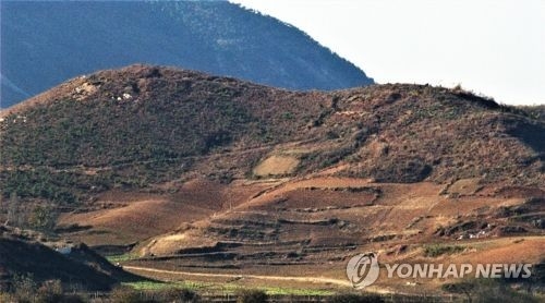 This photo, provided by Green Korea on May 26, 2018, shows a bare mountain in North Korea's border city of Kaesong. (Yonhap)