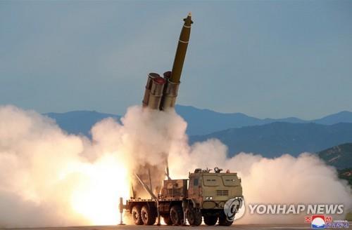 Korea says it tested super-large multiple rocket launcher