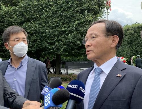 South Korean Ambassador to the United States Lee Soo-hyuck (R) speaks to reporters at the Korean War Veterans Memorial in Washington on June 25, 2020. (Yonhap)
