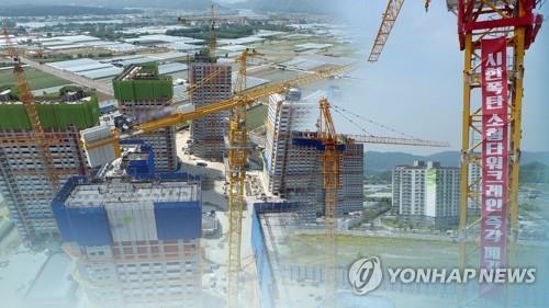 This composite file photo provided by Yonhap News TV shows small tower cranes. (PHOTO NOT FOR SALE) (Yonhap)