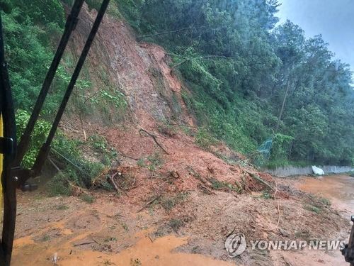 A road is covered in mud after heavy rains triggered a landslide in Seocheon County, South Chungcheong Province, on July 14, 2023, in this photo provided by the county. (PHOTO NOT FOR SALE) (Yonhap)