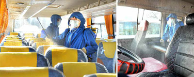 버스 소독 중인 북한 근로자들