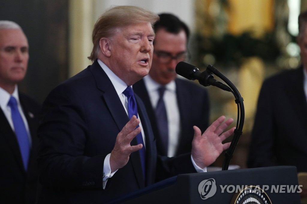 U.S. President Donald Trump gestures during a signing ceremony for a U.S.-China trade agreement in the East Room of the White House in Washington on Jan. 15, 2020. (Yonhap)