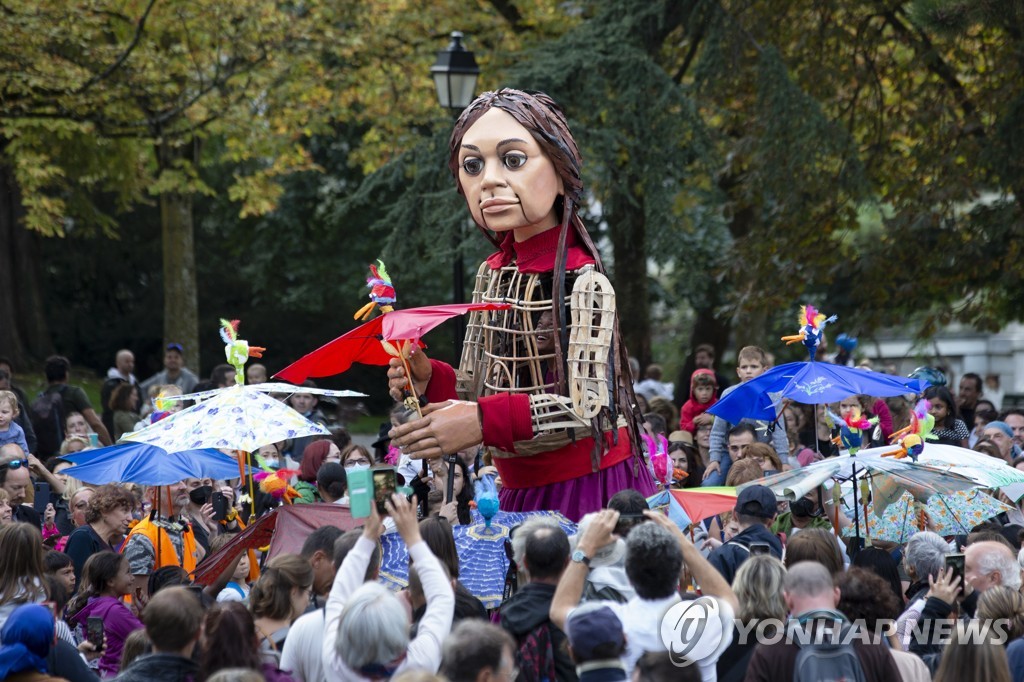 SWITZERLAND GIANT PUPPET AMAL REFUGEES