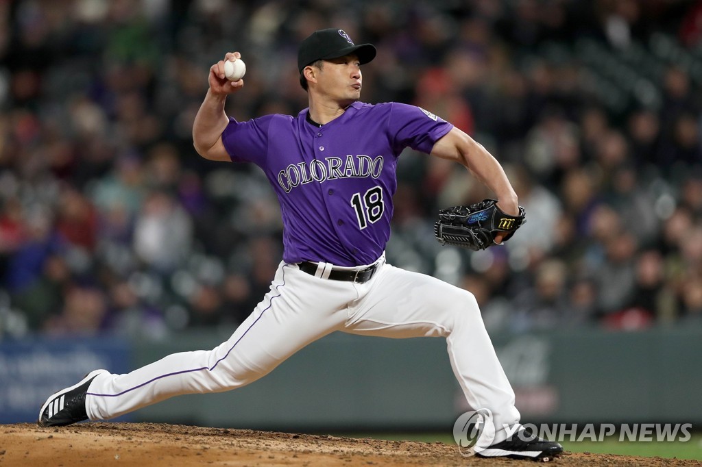 In this Getty Images file photo from April 22, 2019, Oh Seung-hwan of the Colorado Rockies throws a pitch against the Washington Nationals in the top of the seventh inning of a Major League Baseball regular season game at Coors Field in Denver. (Yonhap)
