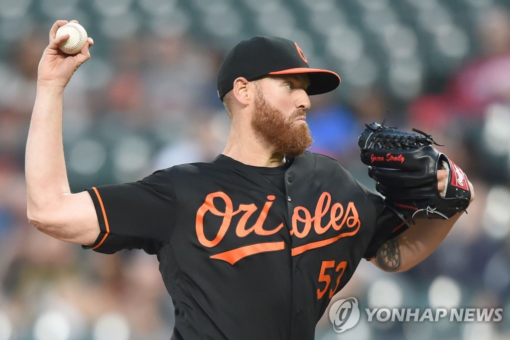 In this Getty Images file photo from May 3, 2019, Dan Straily of the Baltimore Orioles pitches against the Tampa Bay Rays in the top of the second inning of a Major League Baseball regular season game at Oriole Park at Camden Yards in Baltimore, Maryland. (Yonhap)