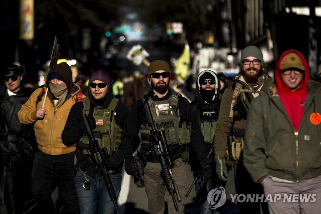 US-GUN-RIGHTS-ADVOCATES-FROM-ACROSS-U.S.-RALLY-IN-VIRGINIA'S-CAP
