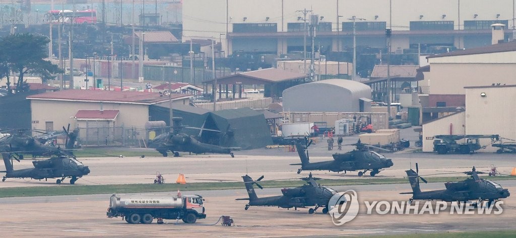 The file photo, taken June 19, 2018, shows a number of military choppers sitting on the ground at the U.S. military base Camp Humphreys in Pyeongtaek, some 70 kilometers south of Seoul, after South Korea and the United States said they decided to suspend their annual joint military exercises in August to foster a mood for dialogue with North Korea. (Yonhap)