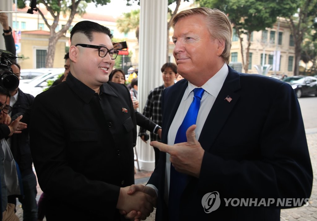 A pair of men impersonating U.S. President Donald Trump and North Korean leader Kim Jong-un appear in downtown Hanoi on Feb. 22, 2019, just days before the leaders' second summit for the denuclearization of the Korean peninsula. (Yonhap)
