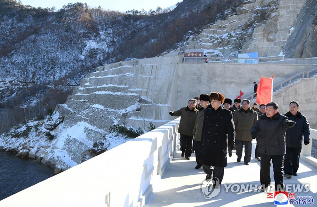 Pak Pong-ju (L, front), vice-chairman of the State Affairs Commission, looks around the Phalhyang Dam of the Orangchon Power Station in North Hamgyong Province, northeastern North Korea, on Dec. 4, 2019, after attending a ribbon-cutting ceremony marking the completion, in this photo released by the North's Korean Central News Agency. The dam's completion came more than a year after leader Kim Jong-un visited the area and lashed out at workers for incompetence and procrastination. (For Use Only in the Republic of Korea. No Redistribution) (Yonhap)