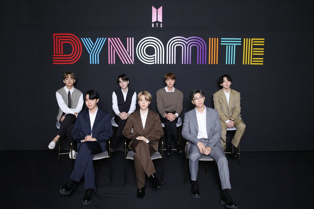This photo, provided by Big Hit Entertainment, shows members of BTS posing for photos during an online media day event in Seoul on Sept. 2, 2020. The band's "Dynamite" topped Billboard's main Hot 100 singles chart in the United States on Aug. 31. (PHOTO NOT FOR SALE) (Yonhap)