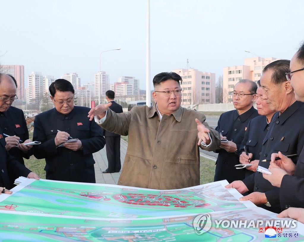 North Korean leader Kim Jong-un visits a construction site for riverside flats in Pyongyang in this photo disclosed by the Korean Central News Agency on April 1, 2021. (For Use Only in the Republic of Korea. No Redistribution) (Yonhap) 