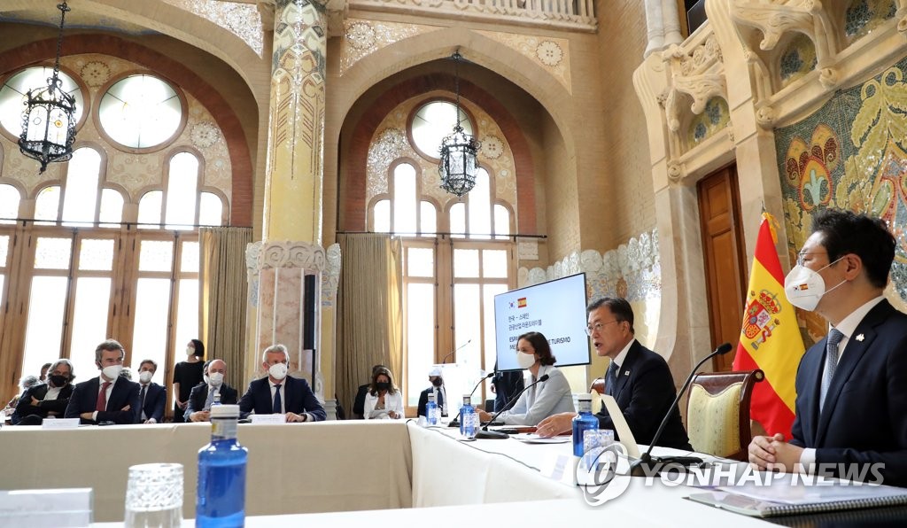 President Moon Jae-in (2nd from R) speaks at a South Korea-Spain tourism industry roundtable event held at the mountain-side monastery of Montserrat in Catalonia, north of Barcelona, on June 17, 2021. (Yonhap) 