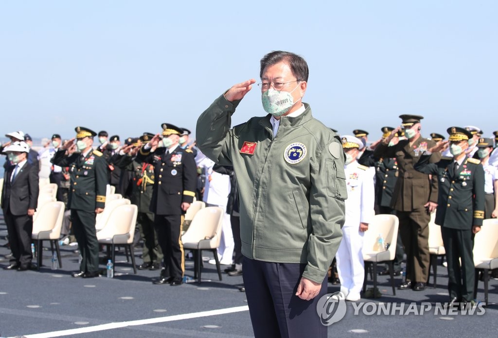 President Moon Jae-in salutes during the 73rd Armed Forces Day ceremony held on board the Marado, a landing platform helicopter ship, in Yeongil Bay near the 1st Marine Division in the southeastern port city of Pohang on Oct. 1, 2021. (Yonhap)