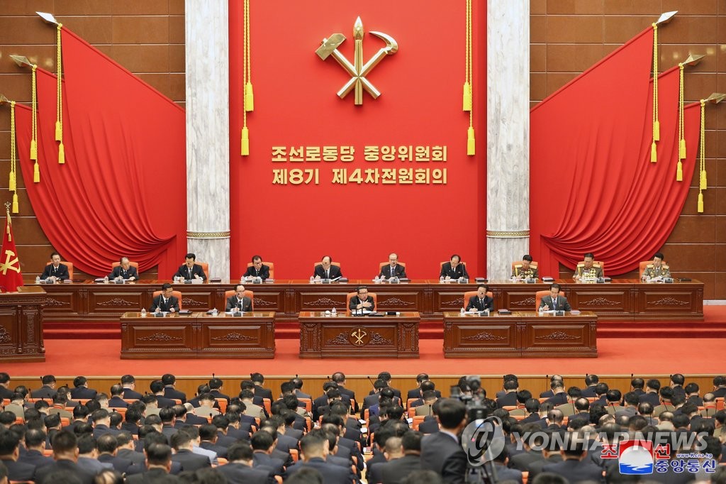 North Korean leader Kim Jong-un (C, front row, on the stage) presides over a plenary session of the central committee of the ruling Workers' Party in Pyongyang on Dec. 27, 2021, in this photo released by the Korean Central News Agency the next day. (For Use Only in the Republic of Korea. No Redistribution) (Yonhap)