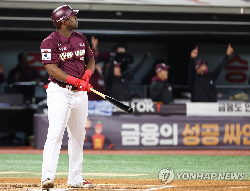 Yasiel Puig of the Kiwoom Heroes watches the ball after hitting a three-run home run against the KT Wiz during the top of the first inning of Game 3 of the first round in the Korea Baseball Organization postseason at KT Wiz Park in Suwon, 35 kilometers south of Seoul, on Oct. 19, 2022. (Yonhap)