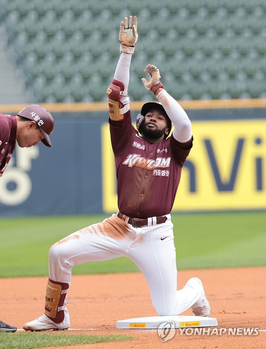 In this file photo from April 21, 2024, Ronnie Dawson of the Kiwoom Heroes celebrates after hitting a triple against the Doosan Bears during a Korea Baseball Organization regular-season game at Jamsil Baseball Stadium in Seoul. (Yonhap)