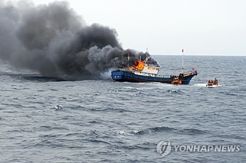 A Chinese fishing boat catches fire on Sept. 29, 2016, in South Korean waters about 70 kilometers southwest of Hong Island near the southwestern city of Mokpo. (Yonhap)