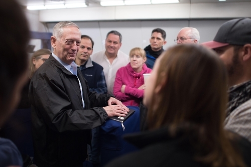 Defense Secretary Jim Mattis answers questions from reporters during a flight to South Korea. Photo courtesy of the Defense Department.