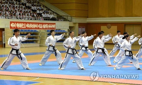 This photo carried by North Korea's state news agency on June 10, 2017, shows young North Korean taekwondo players taking part in a sports event in Pyongyang. (For Use Only in the Republic of Korea. No Redistribution) (Yonhap)