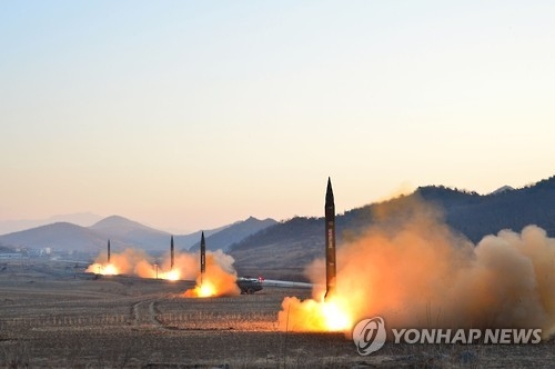 This file photo carried by North Korea's state news agency on March 7, 2017, shows North Korean missile launches under the observance of its leader Kim Jong-un. (For Use Only in the Republic of Korea. No Redistribution) (Yonhap)
