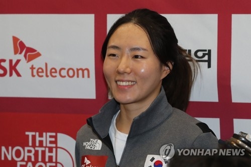 In this file photo taken on Dec. 12, 2017, South Korean speed skater Lee Sang-hwa listens to a reporter's question at Incheon International Airport after returning home from Salt Lake City, Utah, where she competed at the International Skating Union World Cup Speed Skating. (Yonhap)