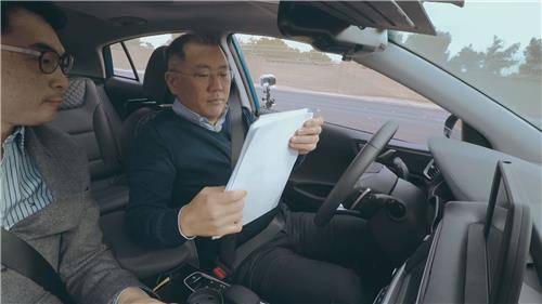 In this undated file photo provided by Hyundai Motor, the carmaker's Executive Vice Chairman Chung Euisun tests an autonomous driving technology in the Ioniq during the Consumer Electronics Show held in Las Vegas in 2017. (PHOTO NOT FOR SALE) (Yonhap)