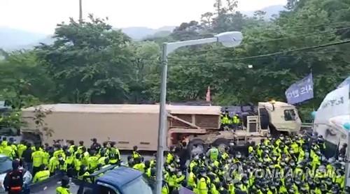 Military vehicles transport equipment to the site of the Terminal High Altitude Area Defense (THAAD) base in the town of Seongju, about 220 km south of Seoul, on May 29, 2020, as part of an upgrade, in this photo released by a group of residents and activists opposing the installation of the missile defense system. U.S. Forces Korea and South Korea's defense ministry, which had only used air transportation to move supplies due to strong opposition by local residents until now, are transporting equipment by ground to and from the system's site. (PHOTO NOT FOR SALE) (Yonhap)