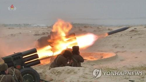 This image captured from a documentary film aired by North Korea's official Korean Central TV on Jan. 10, 2020, shows test-firings of multiple rocket launchers by an all-female military unit on the western border island of Changrin in November 2019. North Korean leader Kim Jong-un oversaw the firing drills. (For Use Only in the Republic of Korea. No Redistribution) (Yonhap)