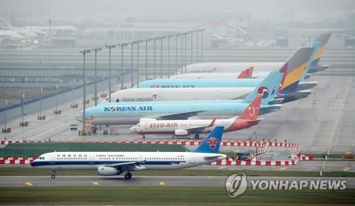This file photo, taken July 29, 2020, shows planes parked at Incheon International Airport, west of Seoul. (Yonhap)