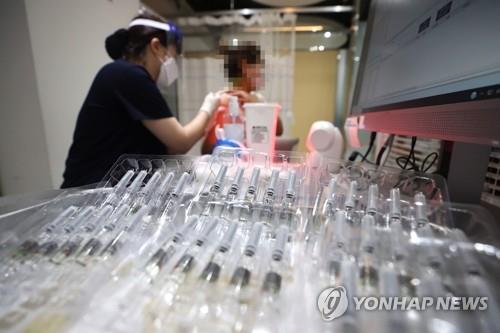 The file photo, taken Sept. 23, 2020, shows a person getting an influenza vaccine at a medical clinic in western Seoul. (Yonhap)
