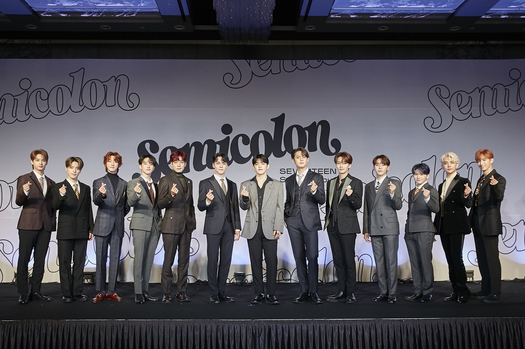 This photo provided by Pledis Entertainment on Oct. 19, 2020, shows members of K-pop group Seventeen posing for photos during an online showcase held at COEX Inter-Continental Hotel in southern Seoul. (PHOTO NOT FOR SALE) (Yonhap)