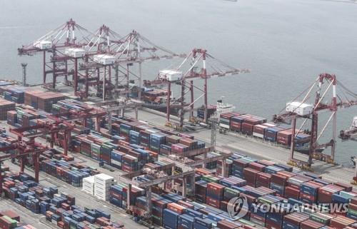 This file photo, taken on June 1, 2020, shows stacks of import-export cargo containers at South Korea's largest seaport in Busan, 450 kilometers southeast of Seoul. (Yonhap)