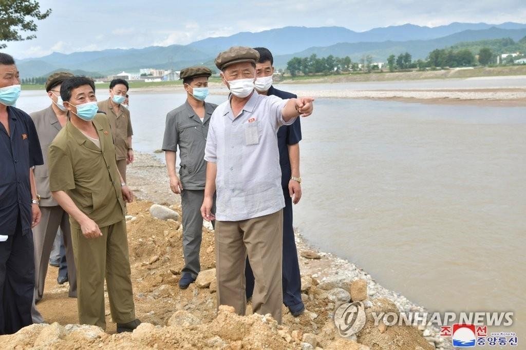 North Korean Premier Kim Tok-hun (2nd from R) visits a flood-hit area in the eastern coastal area of South Hamgyong Province, in this undated file photo released by the Korean Central News Agency on Aug. 12, 2021. (For Use Only in the Republic of Korea. No Redistribution) (Yonhap)