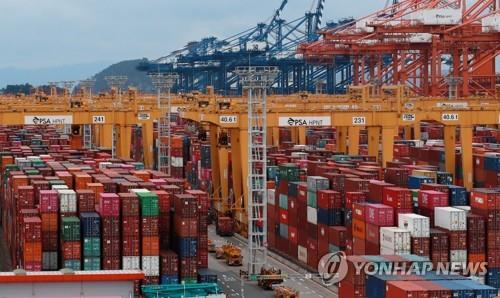 This file photo, taken Sept. 1, 2021, shows containers stacked at a pier in the southeastern city of Busan. (Yonhap)