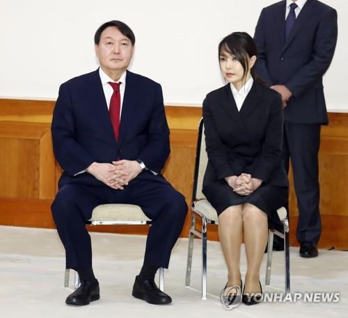 New Prosecutor General Yoon Seok-youl (L) is seated with his wife, Kim Kun-hee, during an appointment ceremony at Cheong Wa Dae in Seoul on July 25, 2019. (Yonhap)