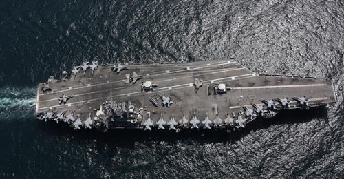 This photo from the Facebook page of the U.S. 7th Fleet shows the USS Abraham Lincoln aircraft carrier engaging in an exercise with Japan's Maritime Self-Defense Force in the East Sea on April 12, 2022. (PHOTO NOT FOR SALE) (Yonhap)