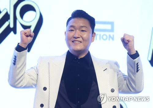 Singer-rapper Psy poses for the camera during a press event to promote his ninth full-length album "Psy 9th" at a Seoul hotel on April 29, 2022. (Yonhap)