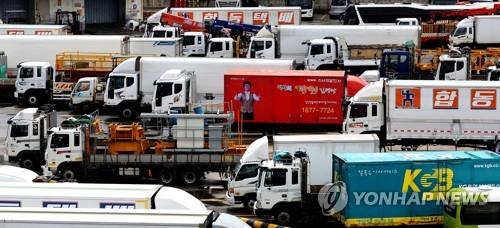 In this undated file photo, cargo trucks are parked at a freight terminal. (Yonhap)