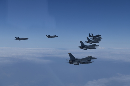 South Korea and the U.S. engage in an air power demonstration, involving F-35A radar-evading fighters, over the Yellow Sea on June 7, 2022, in this photo released by the South's Joint Chiefs of Staff. (PHOTO NOT FOR SALE) (Yonhap)
