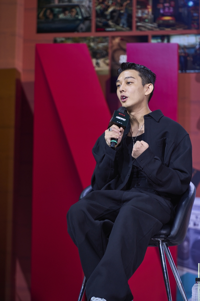 In this photo provided by Netflix, actor Yoo Ah-in speaks during a press conference on the film "Seoul Vibe" in Seoul on Aug. 23, 2022. (PHOTO NOT FOR SALE) (Yonhap)