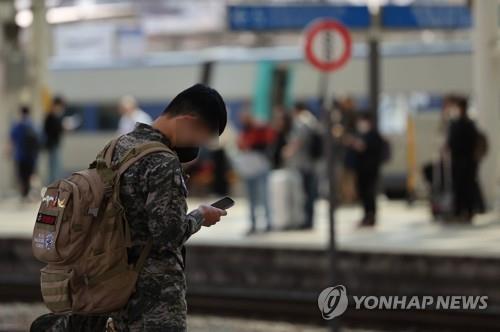 This file photo, taken on May 1, 2022, shows a service member waiting for a train at Seoul Station in central Seoul. (Yonhap)