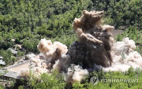 This undated file photo shows North Korea's Punggye-ri nuclear testing site in the northeastern region being blown up in 2018. (Pool photo) (Yonhap)