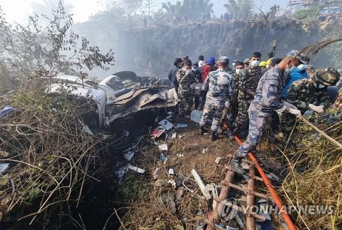 (LEAD) Two bodies believed to be S. Korean victims of Nepal plane crash placed at local hospital