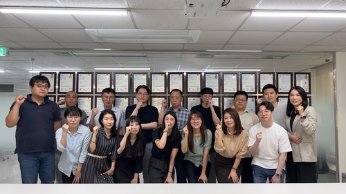 This photo provided by HoneyNaps shows its employees posing for a photo on May 22, 2023. (PHOTO NOT FOR SALE) (Yonhap)