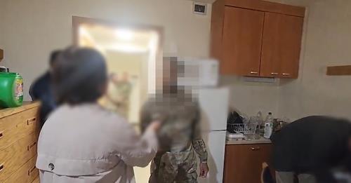 This photo provided by police shows a raid on the home of a USFK soldier suspected of being involved in drug trafficking. (PHOTO NOT FOR SALE) (Yonhap)