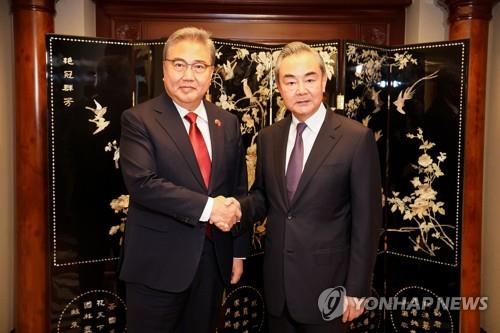 Foreign Minister Park Jin (L) shakes hands with Chinese Foreign Minister Wang Yi ahead of their bilateral talks at the Shangri-La hotel in Jakarta, Indonesia, on July 14, 2023, in this file photo provided by Park's office. (PHOTO NOT FOR SALE) (Yonhap) 