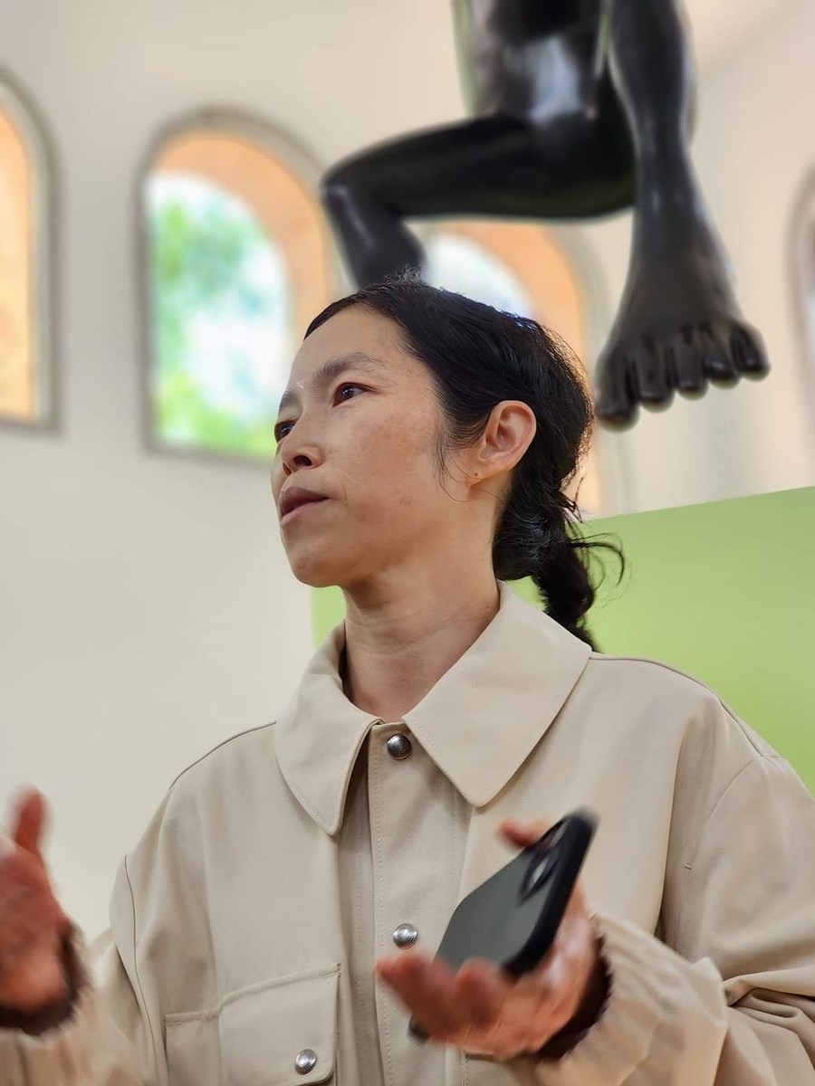 Multimedia and installation artist Koo Jeong A speaks to the media in the Korean Pavilion of the Venice Biennale on April 17, 2024. (Yonhap)