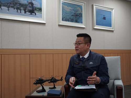 Jo Youn-jea, the chief of the Korean Aerospace Industries' (KAI) rotary-wing business department, explains the export strategy for the Light Armed Helicopter during an interview with Yonhap News Agency on May 14, 2024, at the assembly line in Sacheon, about 300 kilometers southeast of Seoul, in this photo provided by KAI. (PHOTO NOT FOR SALE) (Yonhap)